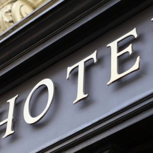 gold sign on exterior of hotel gold sign on exterior of hotel